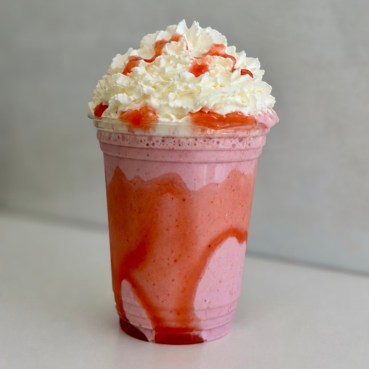 Strawberry milkshake with whipped cream